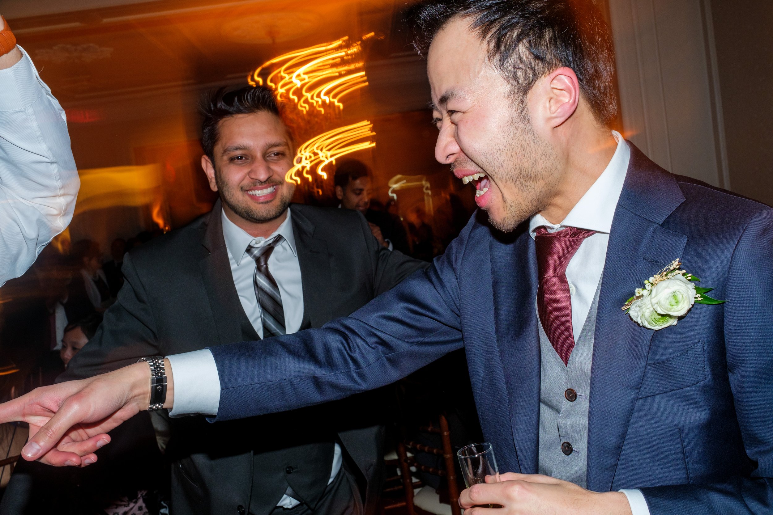  A candid wedding photograph of Jarvis dancing during the wedding reception at Graydon Hall in Toronto, Ontario.  Photograph by Toronto Wedding Photographer Scott Williams.  