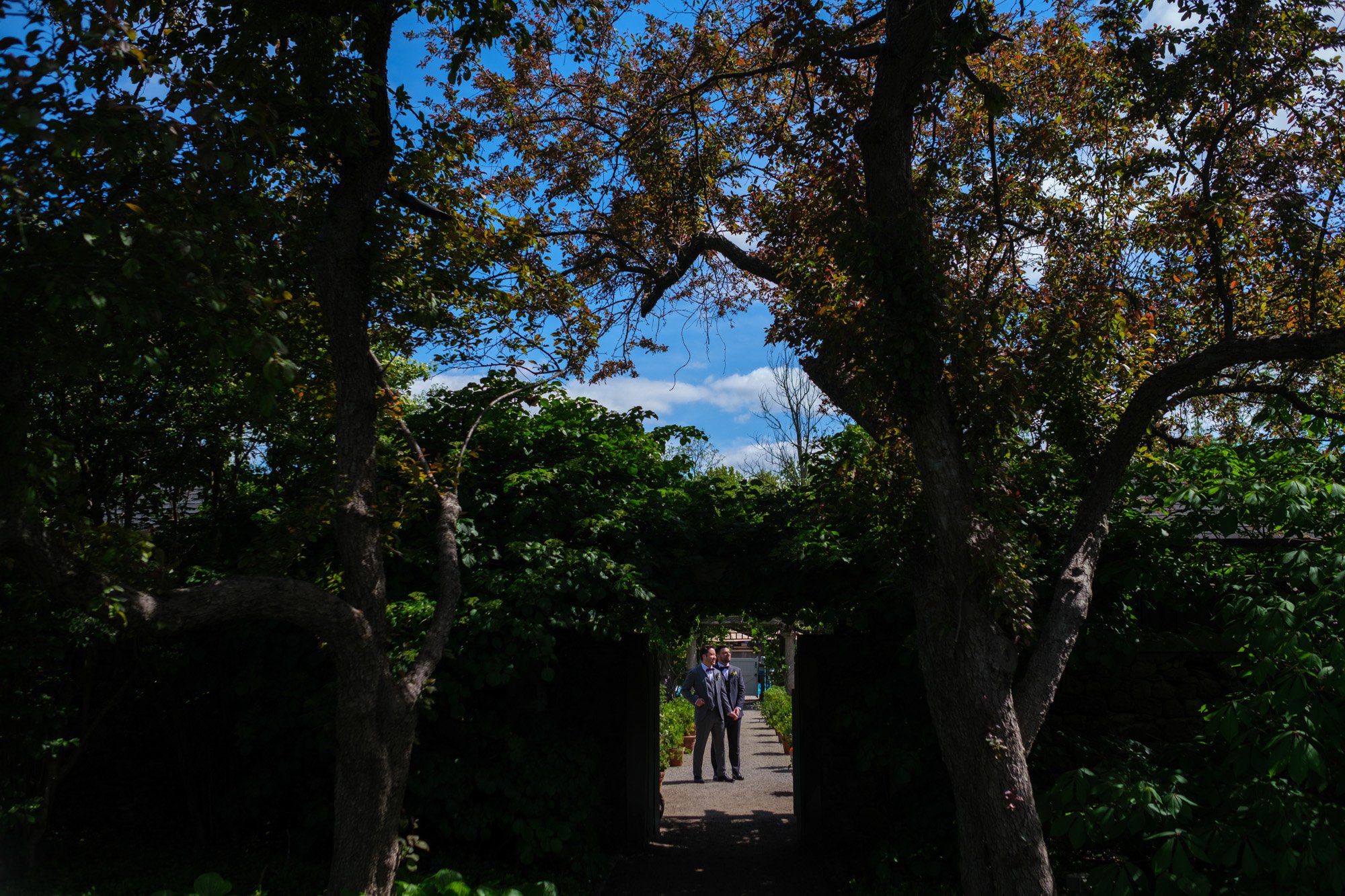  A colour wedding portrait of Greg and Damon after their first look on the grounds of Langdon Hall before their wedding ceremony.  Photograph by Toronto wedding photographer Scott Williams (www.scottwilliamsphotographer.com) 