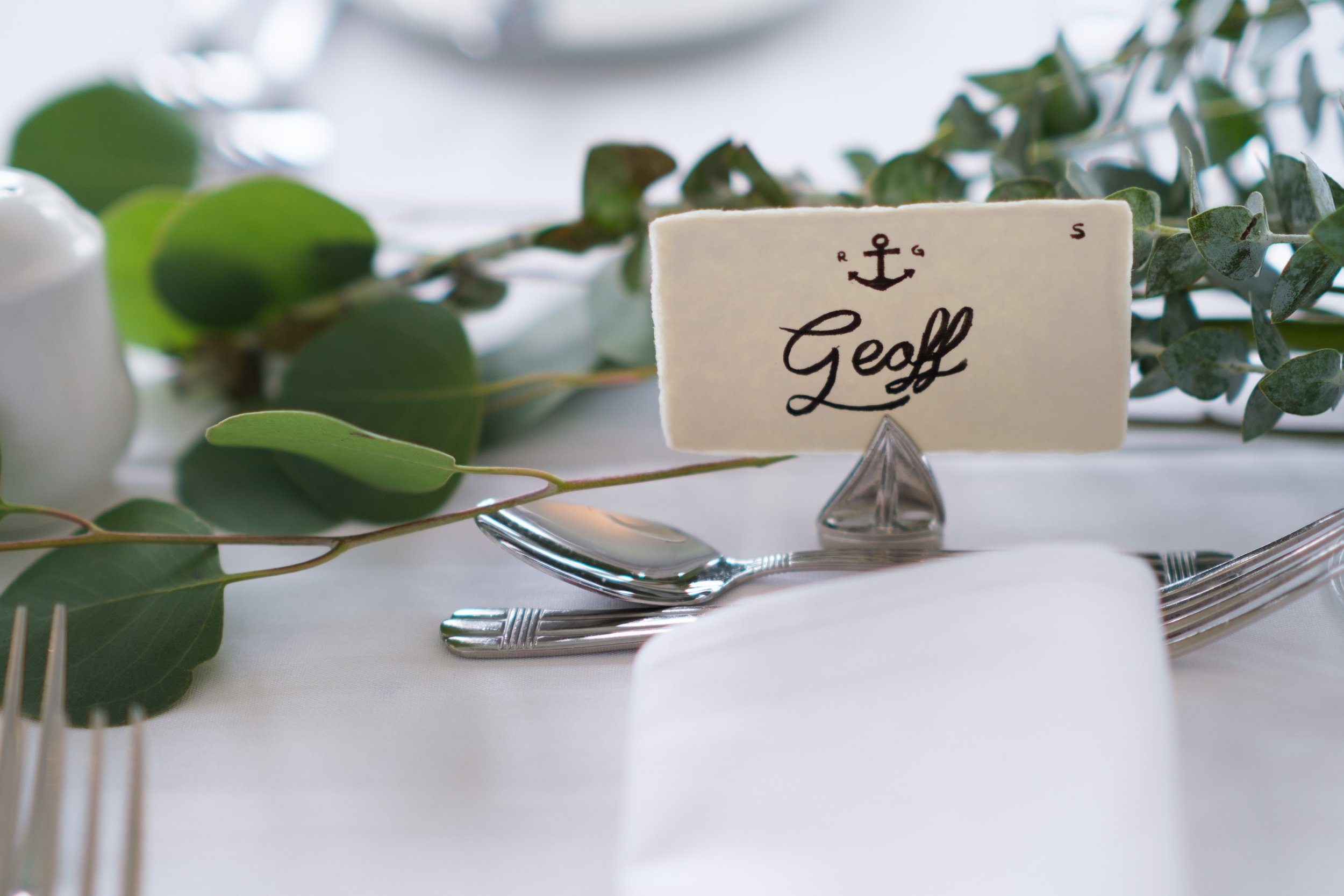  A colour wedding detail photograph of a place setting at the wedding reception of Rocio and Geoff  at the Royal Canadian Yacht Club by Toronto wedding photographer Scott Williams  