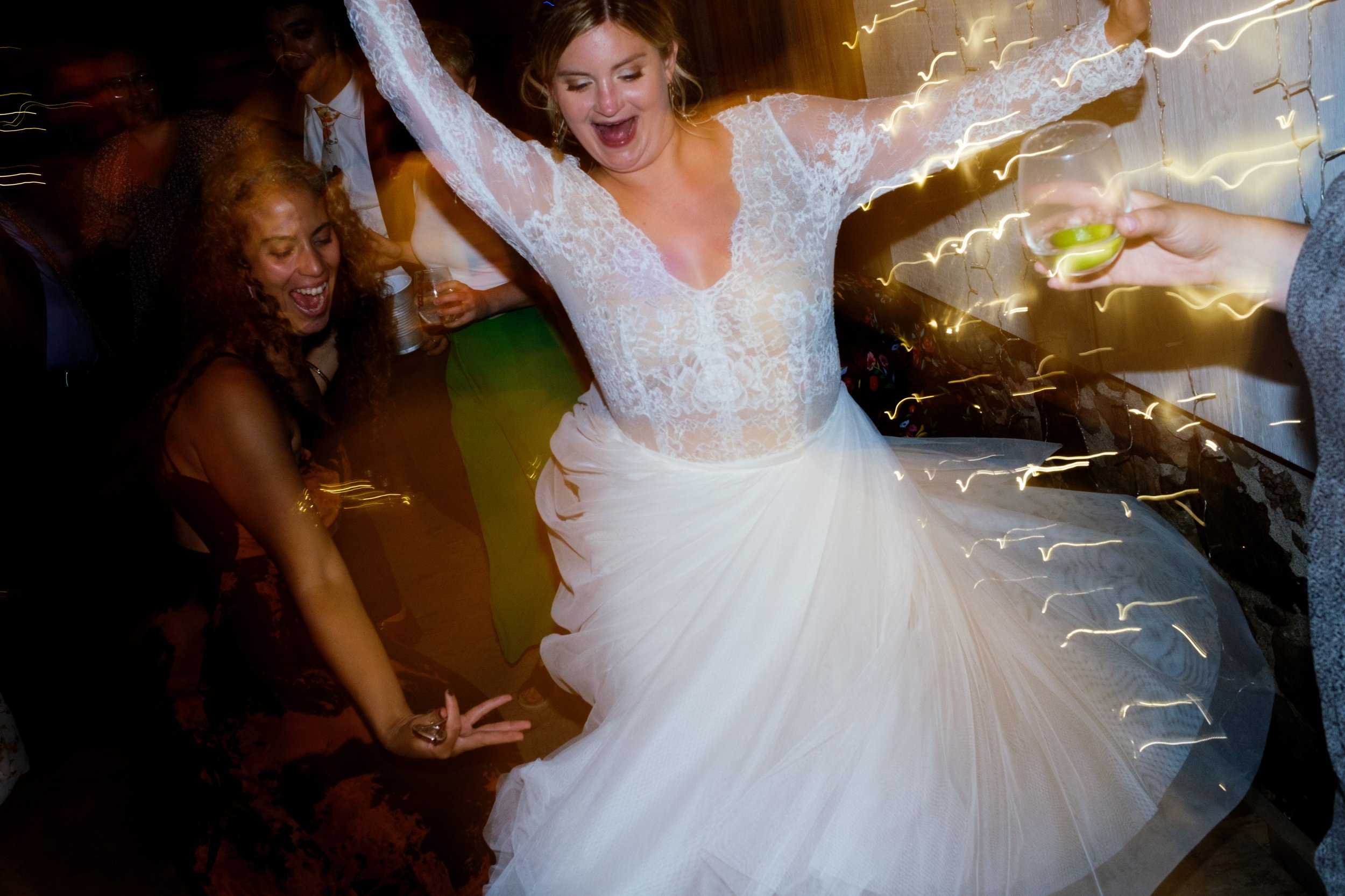  A colour candid wedding photograph of guests dancing during the wedding reception at Ailish + Evan’s outdoor farm wedding near Pickering, Ontario by Toronto wedding photographer Scott Williams  