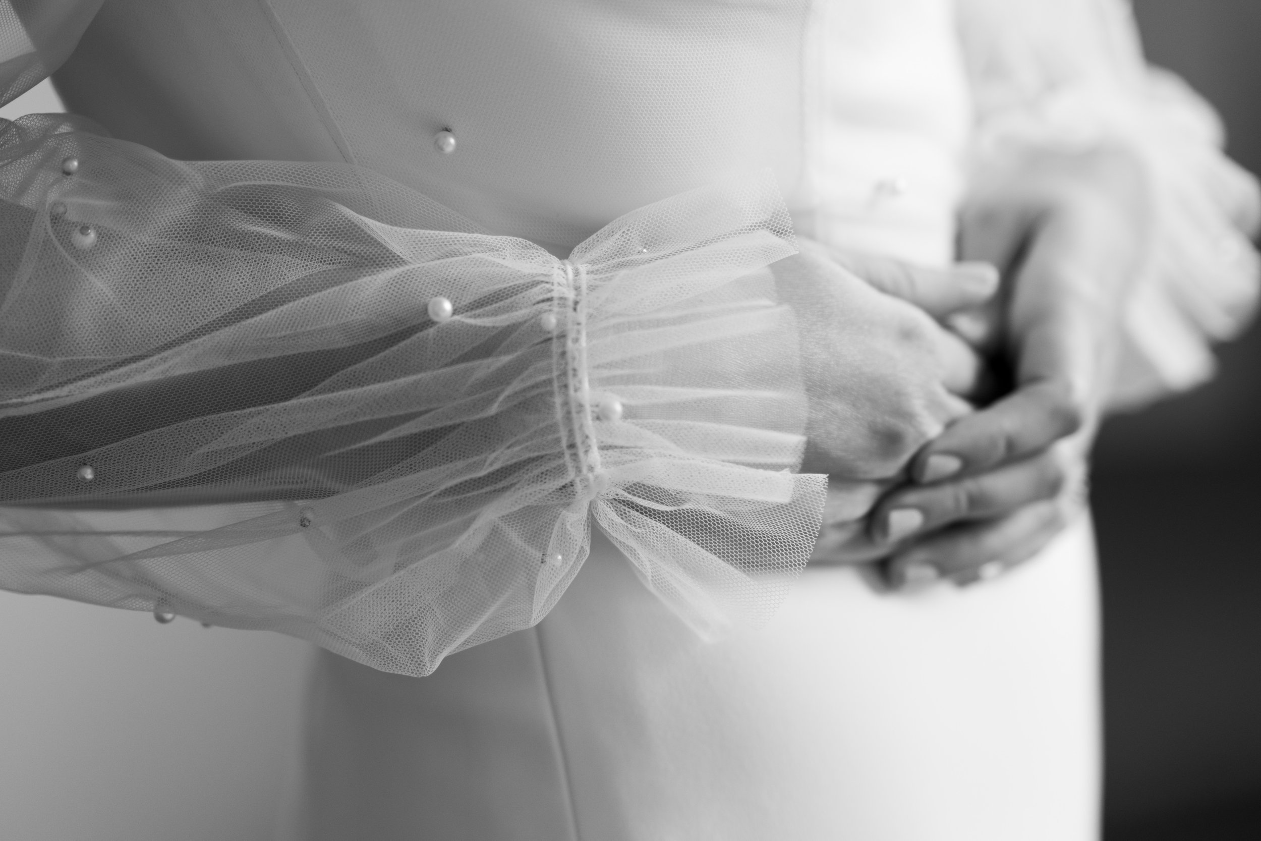  A black and white detail wedding photograph from Megan + Josh’s Kitchener wedding at The Museum.  The brides dress is shown in her hotel suite at the Walper Hotel  in Kitchener by Toronto Wedding photographer Scott Williams (www.scottwilliamsphotogr