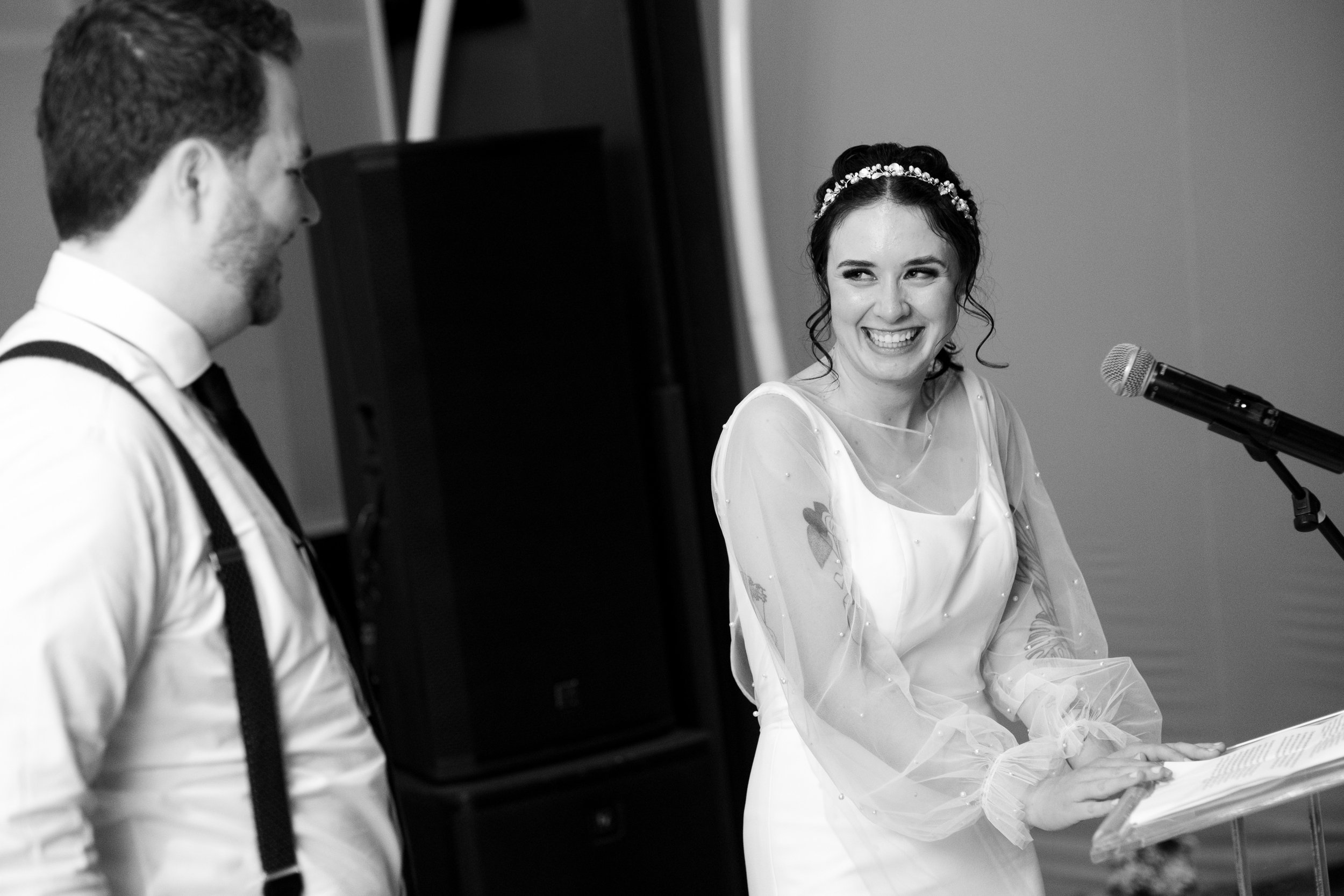  A black and white candid wedding photograph  from Megan + Josh’s Kitchener wedding during the wedding reception at The Museum in Kitchener, Ontario by Toronto Wedding photographer Scott Williams (www.scottwilliamsphotographer.com) 