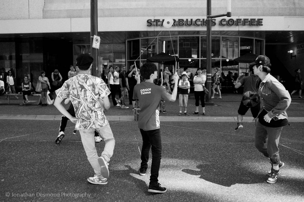 I didn't get a chance to check out this whole routine and, for that matter, I was also behind them (their act was positioned to face the other way) but it was really cool to see them performing some cool dance moves while the person in the center chucked around the spinning top.