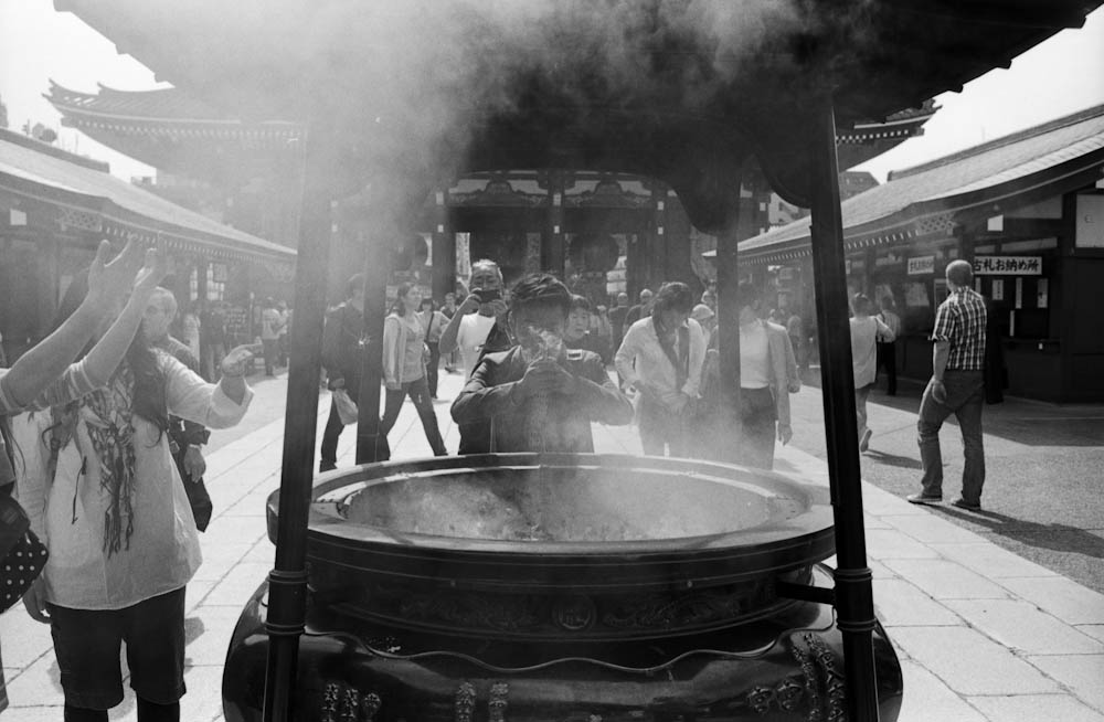 Senso-ji (Asakusa), Tokyo - people would pull the smoke coming from this large incense pot onto themselves as a form of cleansing before entering the temple.