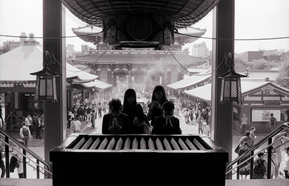 Senso-ji (Asakusa), Tokyo - you could hear the coins drop in between the wooden separations just before people prayed.