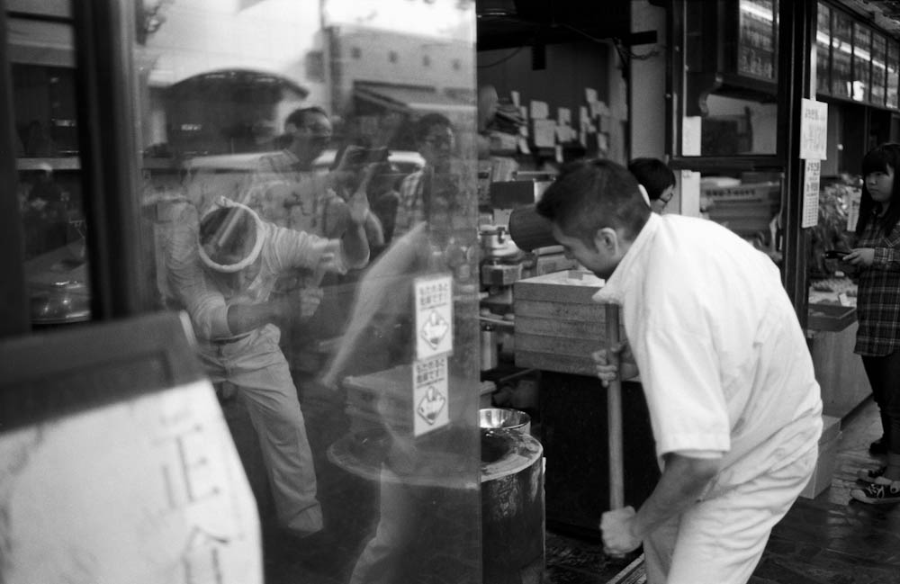 With onlookers like myself looking on, two guys from a shop in Nara pound and create delicious mochi the old-fashioned way.