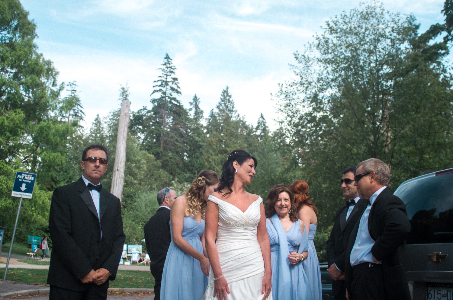 I love how the sunglasses on the groomsmen contrasts with the sky blue dresses of the bridesmaid and the bride in the center of it all.