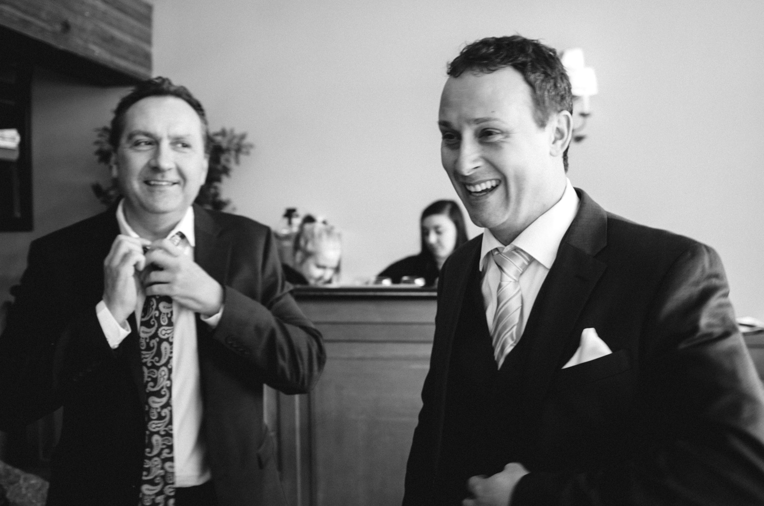 Smiles and expressions really make for a great telling of moments. Here, the groom is smiling while in conversation with some of the other guests. The preliminary stress and nervousness can be daunting for a groom and a bride so I love finding moments like these to show the feelings of the day and hopefully allow the bride and groom to recall these moments.