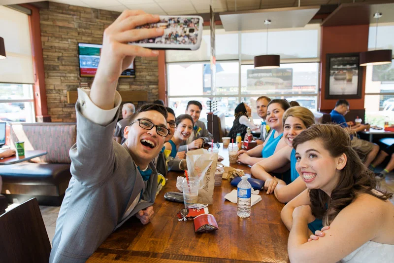 You know, wedding days can be really long days and sometimes you just need a break. I followed the bride, groom and the entire wedding party to Tim Hortons, where I spent some time with them and caught them doing a selfie. Timmies on your wedding day? Heck yeah!! (Seconding with Natahsha Priya Photography)