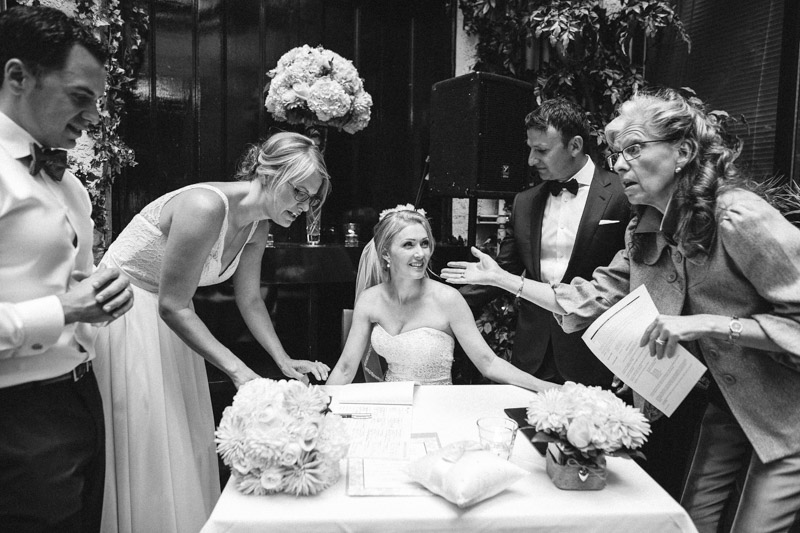 This moment, from Nick and Dayna's wedding, represents my philosophy and mentality when it comes to documenting a wedding. Most photos of signing of the registry usually consist of smiles and looking at the camera... and while I do get that if the couple smile for me, I'm always on the lookout for a "decisive moment" like this one where everything comes together in one amazing moment of interaction that tells everything going on.