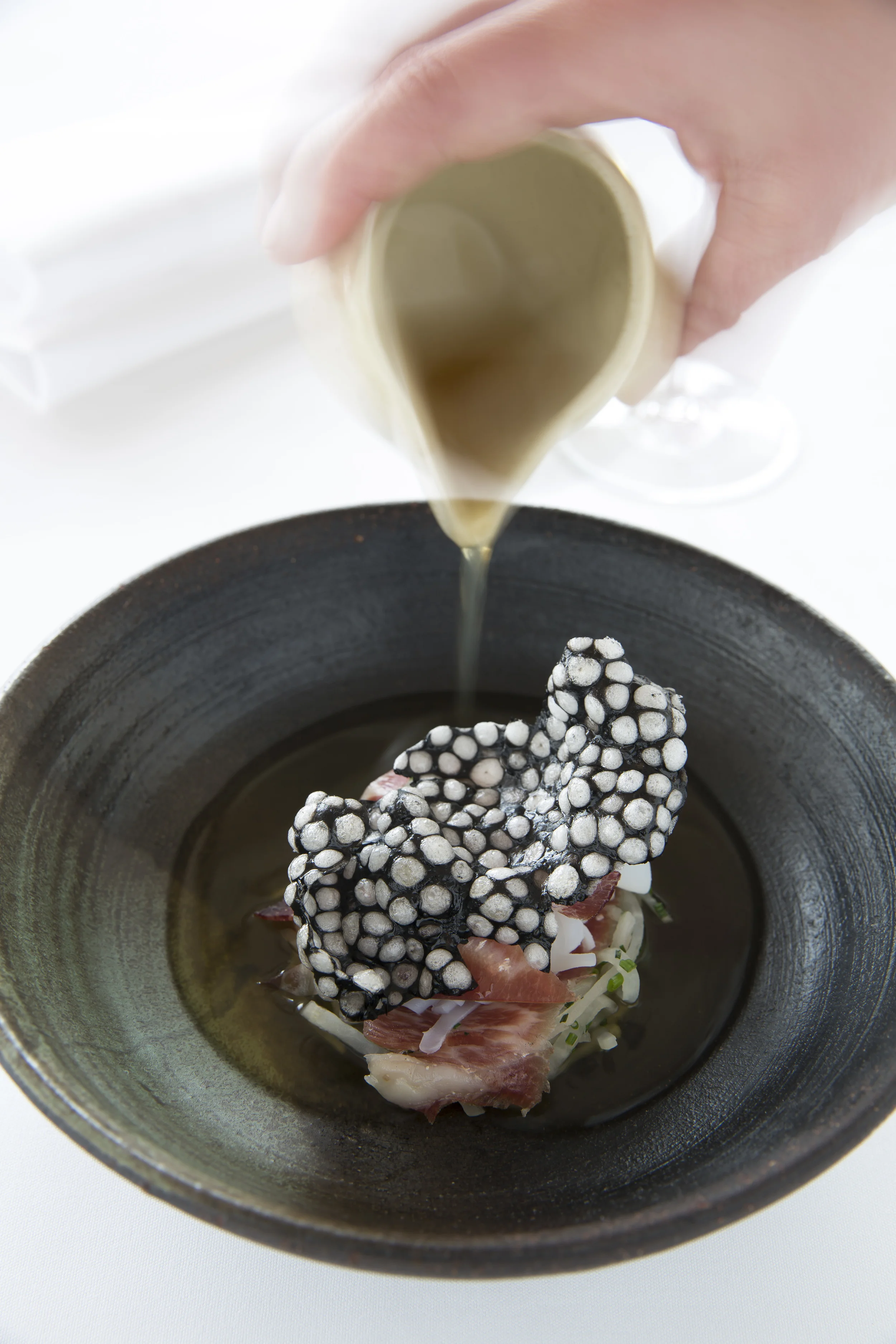 Calamari in mushroom tea