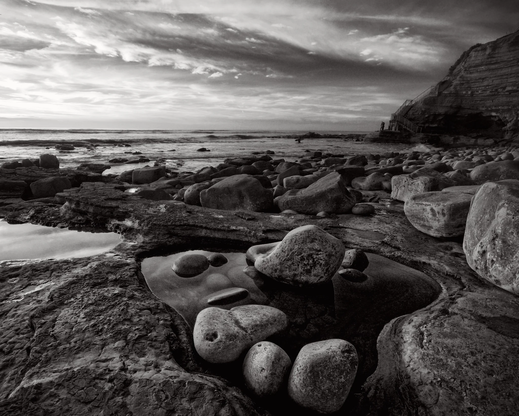 Rocks bathe in a small tide pool 