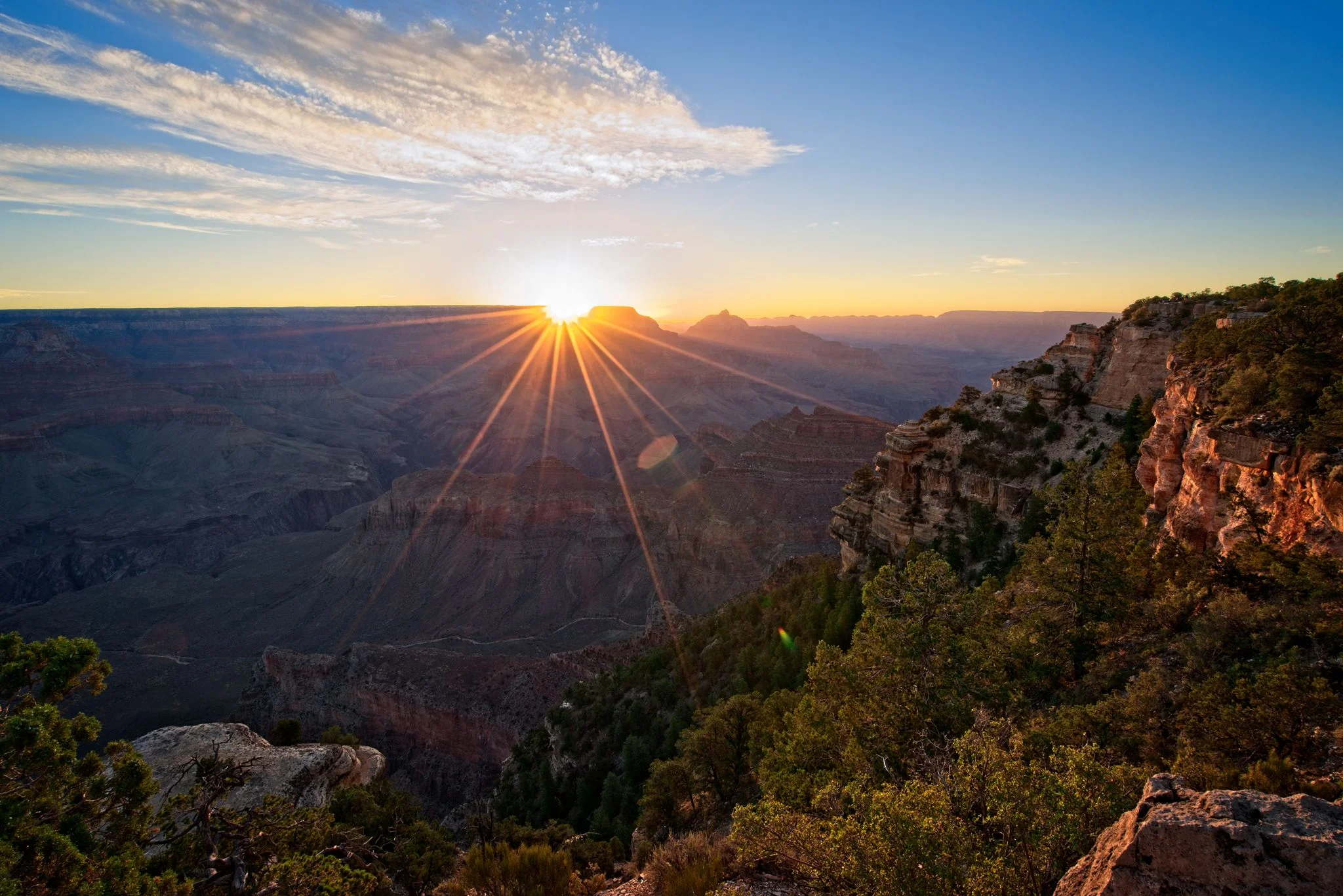 Witnessing sunrise at the Grand Canyon is nothing less than great. The scene continually changes as the morning light creeps downward into the canyon, bathing the rock in golden light.