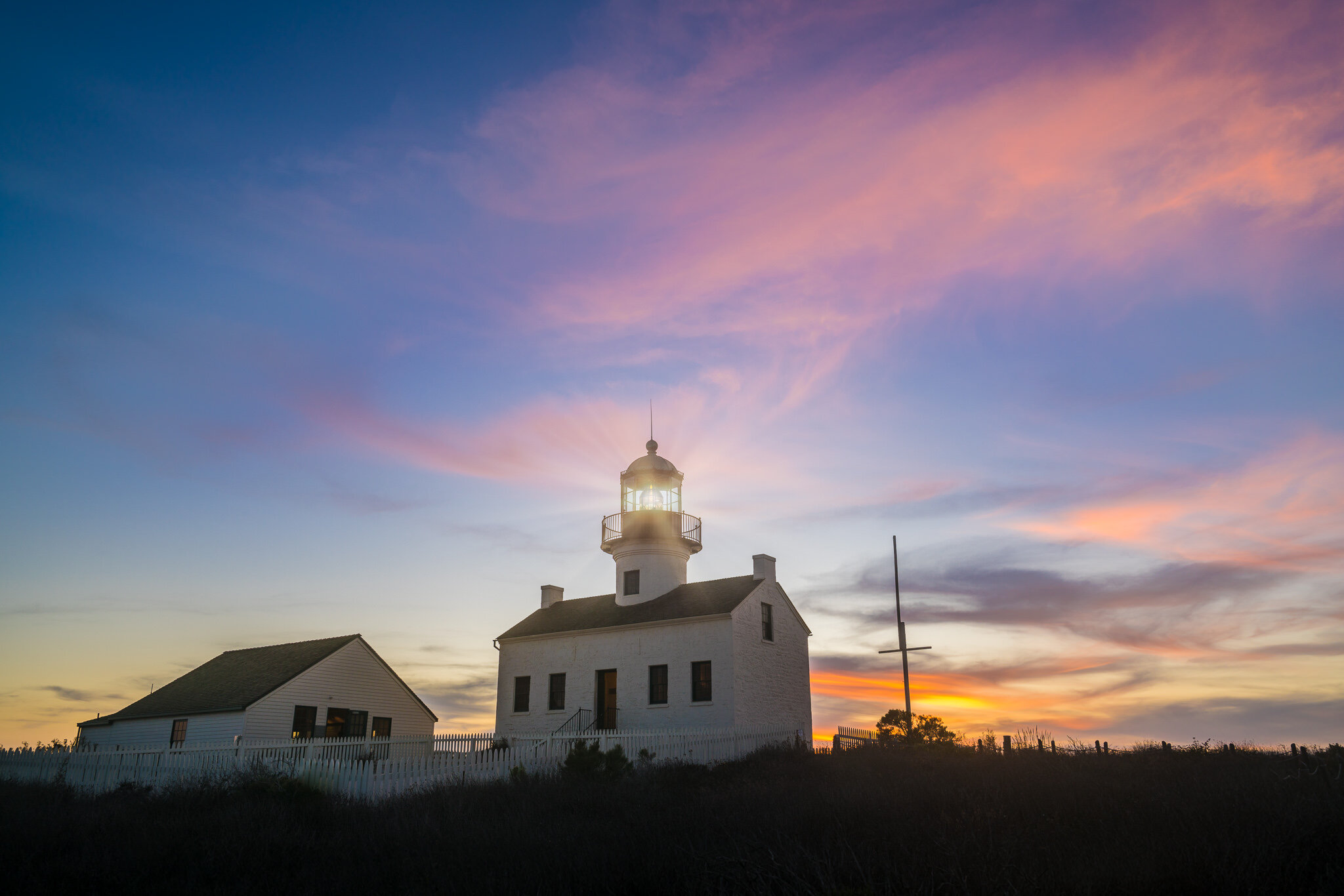 Point Loma Lighthouse At Sunset With Light