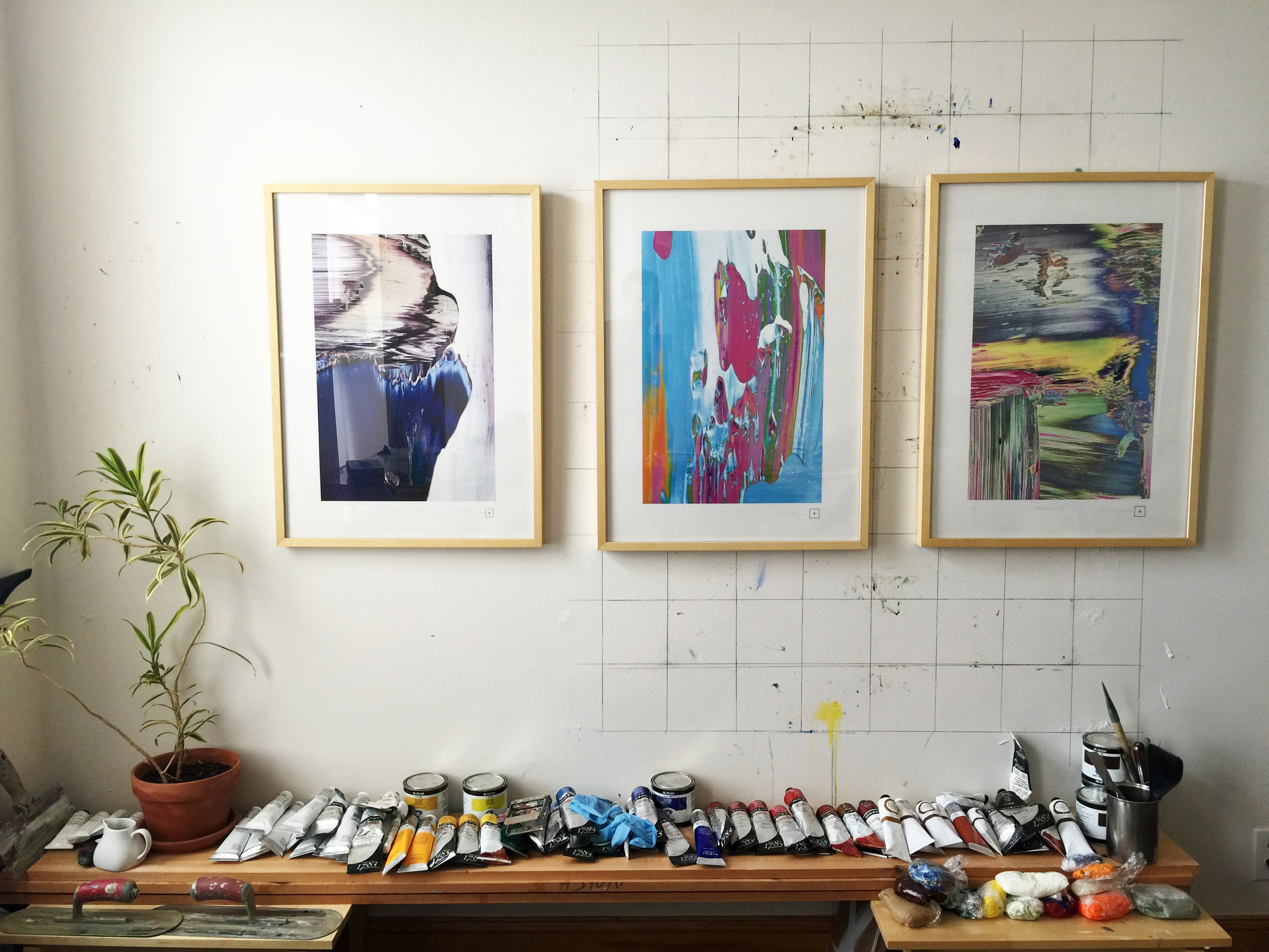 Three prints, "Iris, (March 31, 2014 detail 1)," "Swimming Pool," & "Plastic Spring" hanging on the wall in my studio.