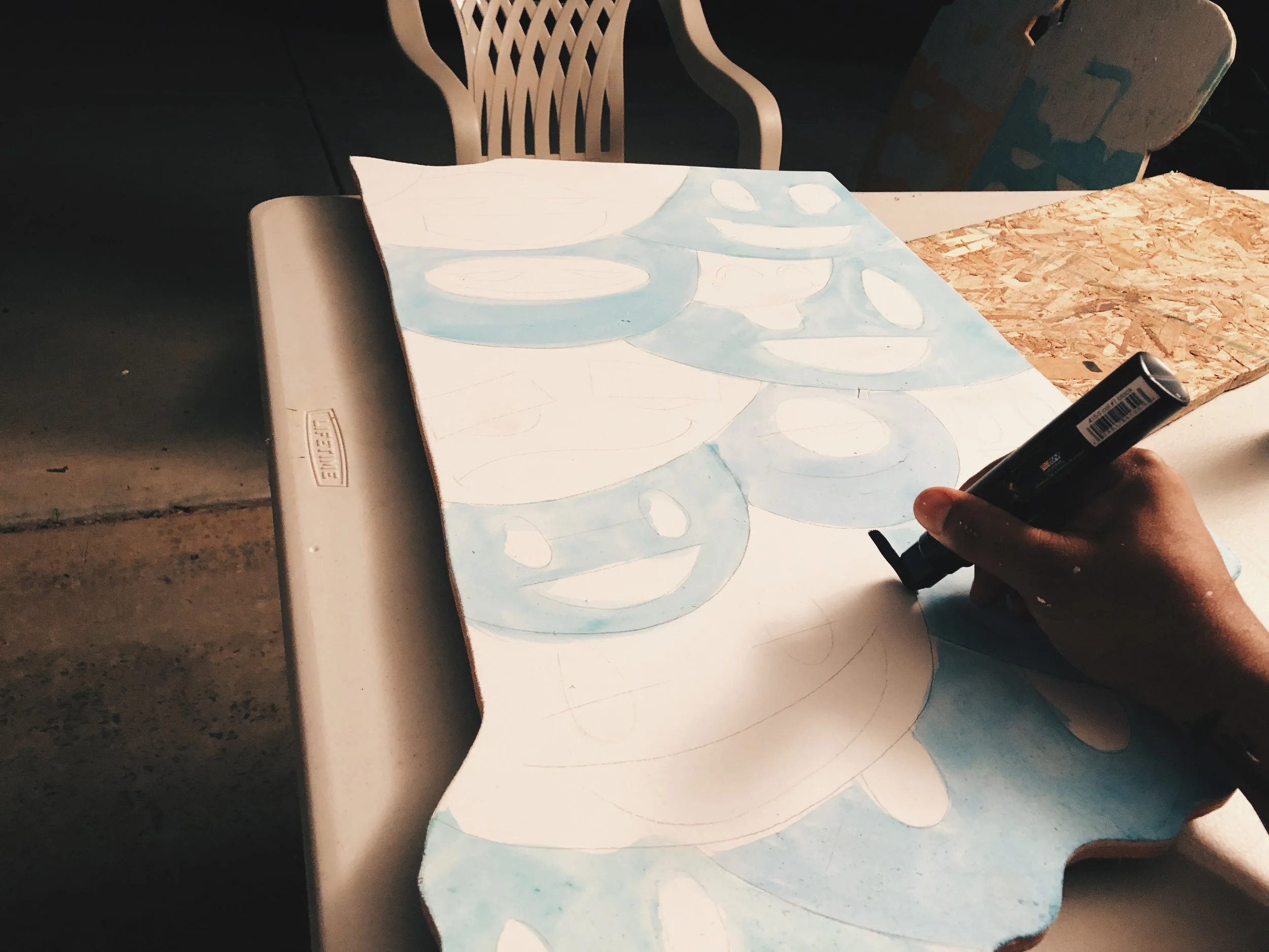 Once the color is dry I started outlining. This is the fun part when you get to see it all come alive. After hours and hours prep work, the pieces start to take shape and come alive. I use a super thick acrylic ink marker. The black is rich and very dark. 