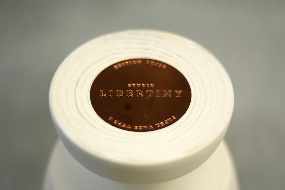 Each vase has its own unique copper plate with an etched number.