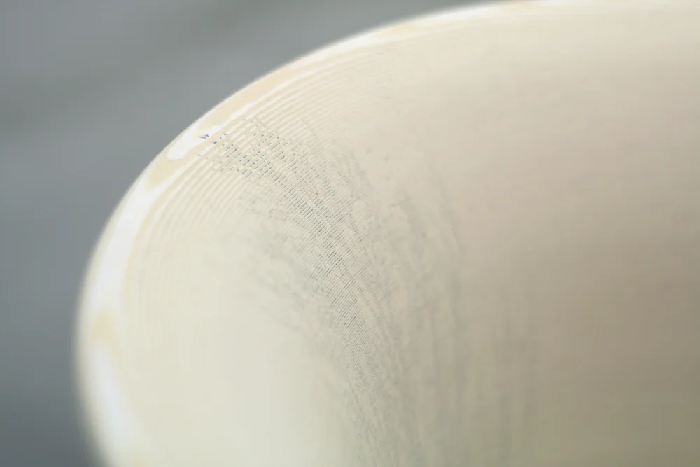 The detail of the ghost image on the interior side of the vase. Note: the paper naturally changes color over years becoming more warm bone white.&nbsp;