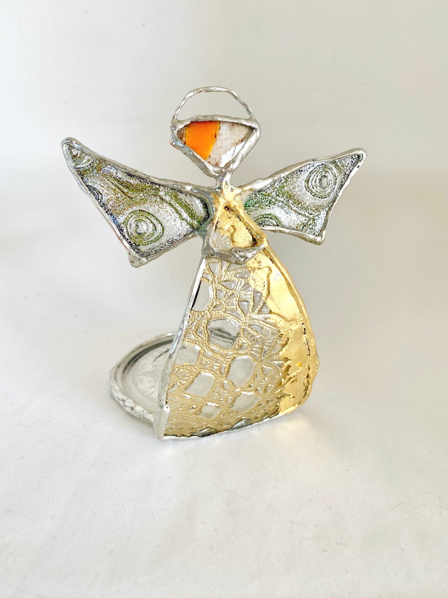 Gold and Silver Angel that can hold a candle