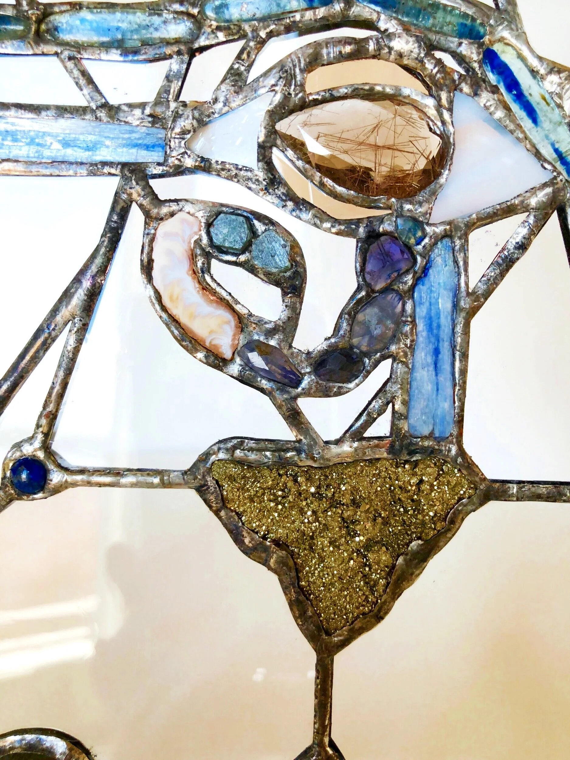 sapphire, rutilated quartz, eye of Horus, chakras, stained glass