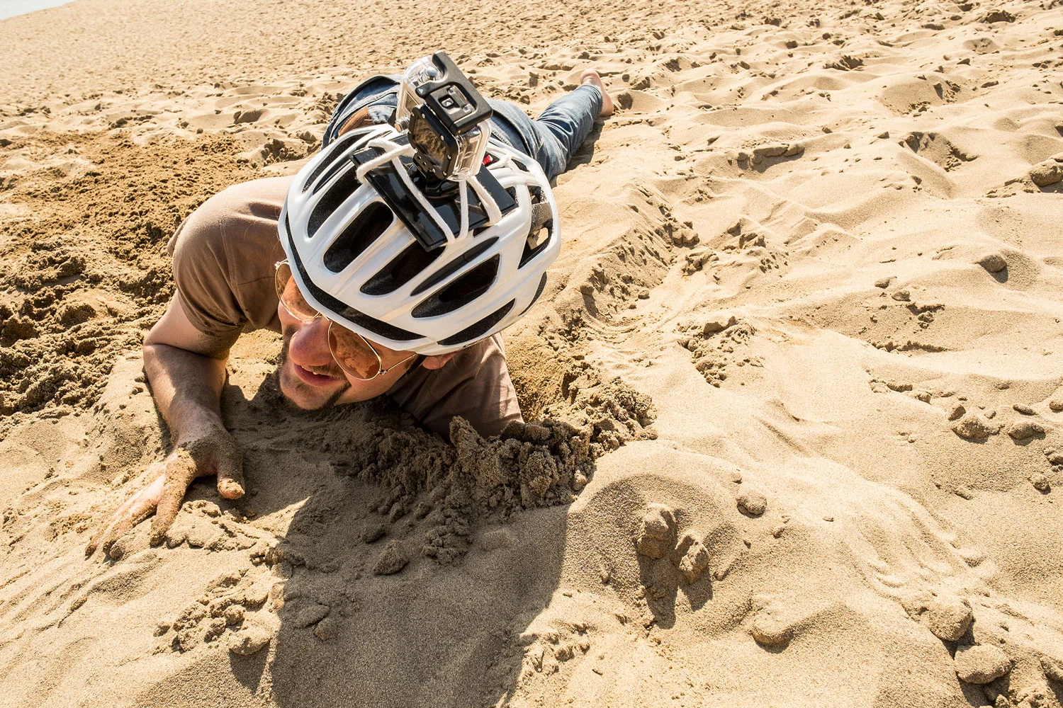 Sio enjoying the long forgotten pleasure of digging holes in the sand! 