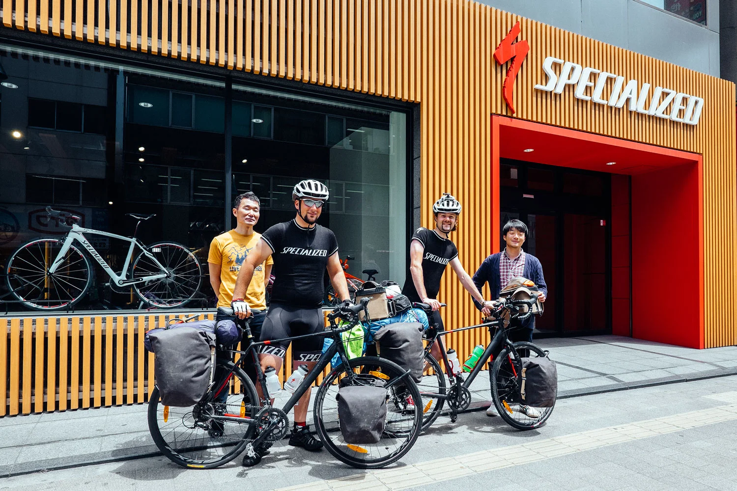 The two of us, our bikes, Kenta and Shuhei, in front of the Specialized HQ Japan