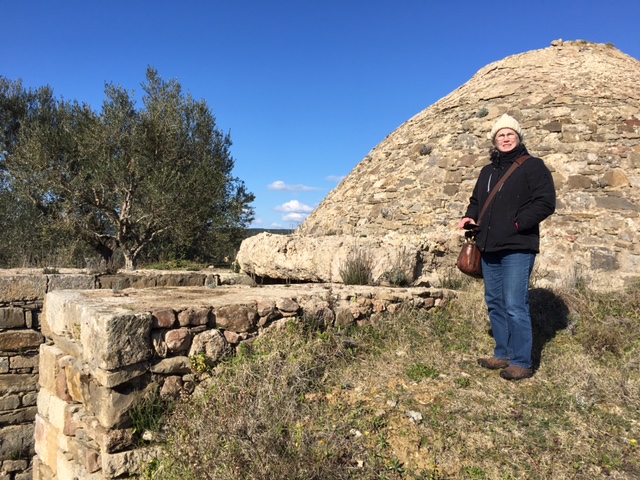 Laura in front of a tholos (beehive) tomb at the Palace of Nestor.