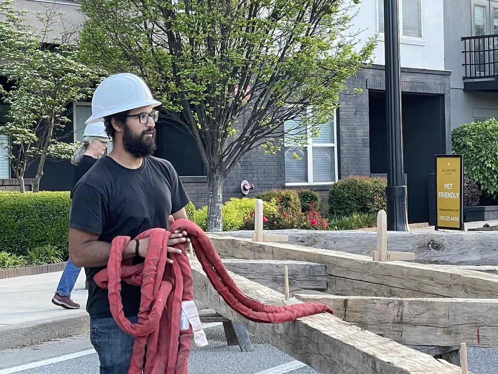 Zane Mitra, removing the rigging used to fly the truss from the terrace to the street.
