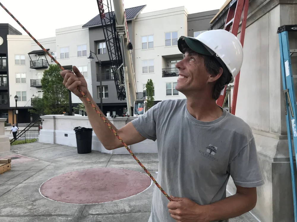 Timber framer, Ross Beebe, is always quick to smile, keeping the whole crew laughing through long hot days of work.