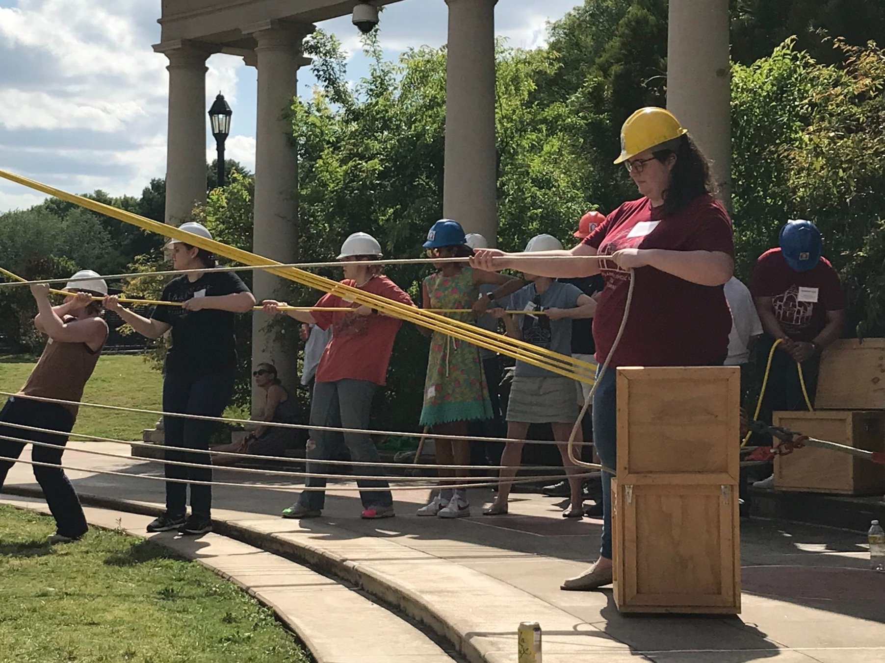 Kelsey Riordan, CUA MA in Architecture Alumna commanding the ropes in the hand-raising demonstration. 