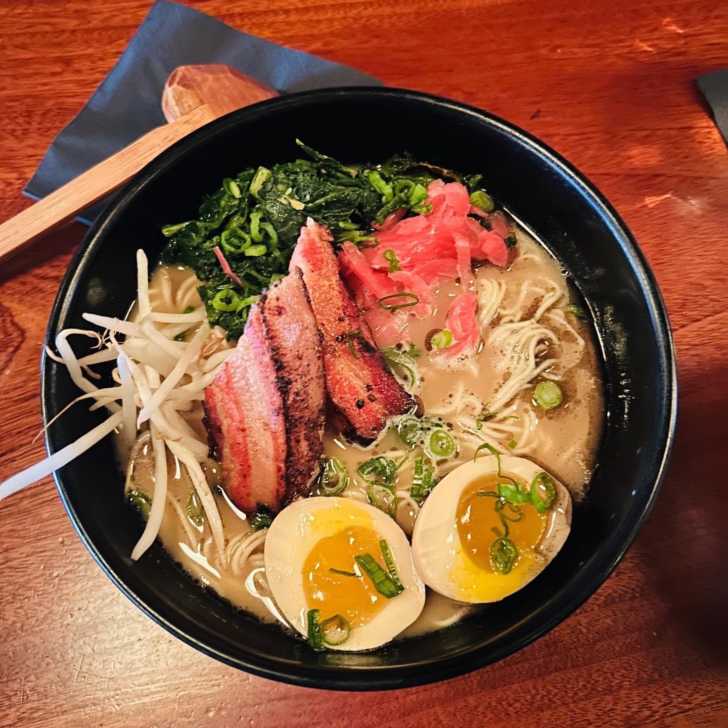 Ramen &ndash; Where soup &amp; noodles become &quot;broth-ers&quot; 😏🍜 Featured here: our Tonkotsu made with roasted pork belly, mustard greens, bean sprouts, pickled red onions, black garlic oil, scallions, &amp; a soy marinated egg 😋