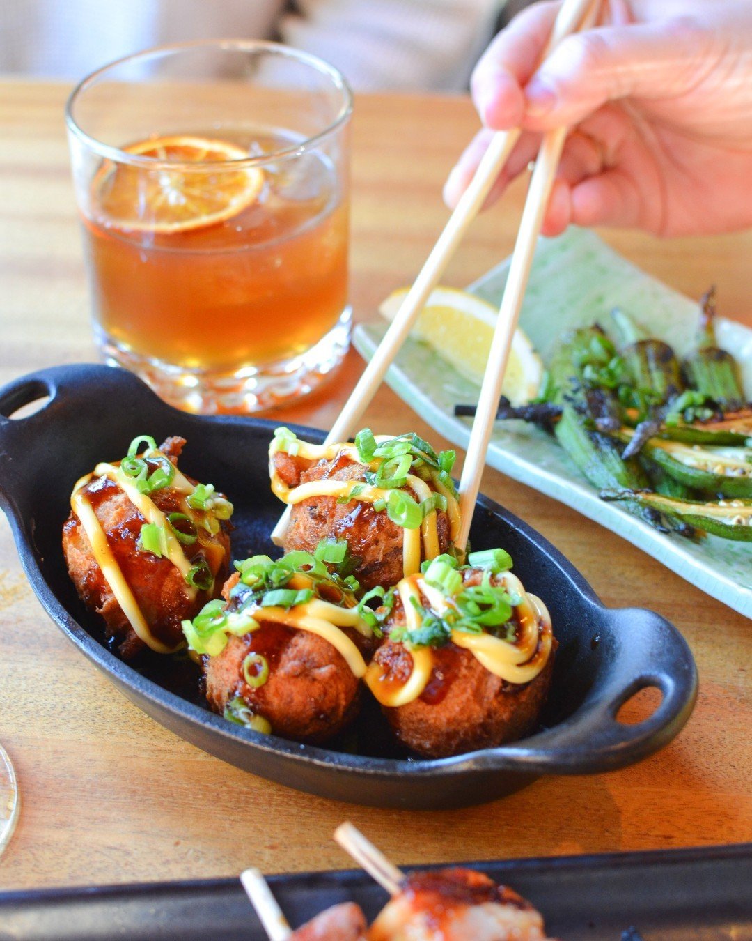 ✨🐙 Takoyaki Hushpuppies: the best way to start your week &ndash; or your meal! 🐙✨ One of the most popular Japanese street foods meets a Southern classic in this small plate &ndash; a fried &quot;octopus ball&quot; topped with tangy BBQ sauce, a dol
