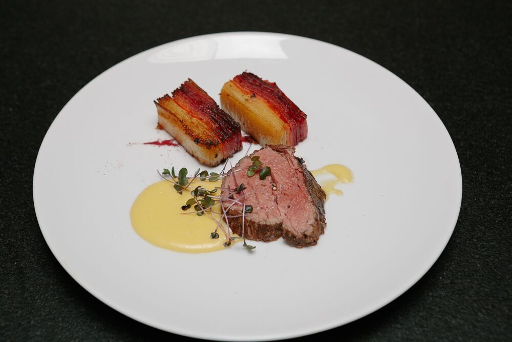 beef tenderloin. root vegetable pave'. béarnaise. beet powder