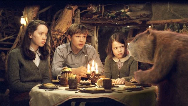 The Beavers explaining to the Pevensies about Aslan, the Witch, the prophecy, and what it all has to do with them