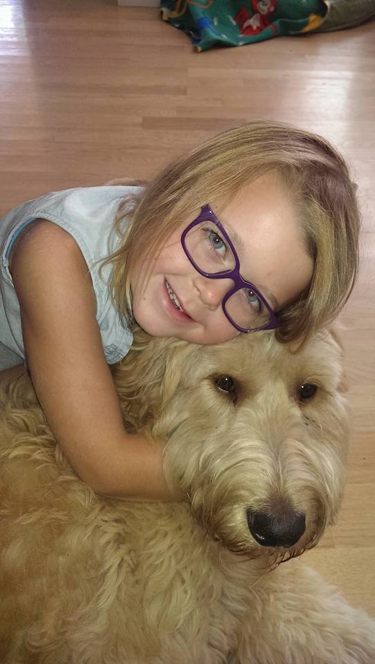 ROCKY This little girl sure does love her puppy. Can you tell how happy he is to be smothered by her too. He's got the typical boy look of "someone please save me from the PDA". Thanks again Star View Kennels for a wonderful dog. We sure do love our Rocky Boy. — with Meaghan Rust-Matter .