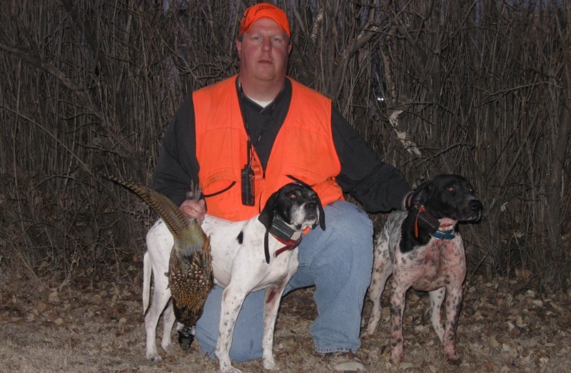 Chris Lecuyer with his bird dogs after a successful hunt.