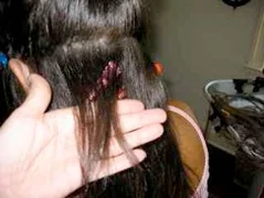 Look at the regrowth
where the shaved bits were! This hair has also had extensions attached
to it since it was 1 inch—NO DAMAGE!
