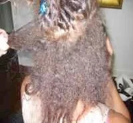 Combing out yukky sewn in extensions.