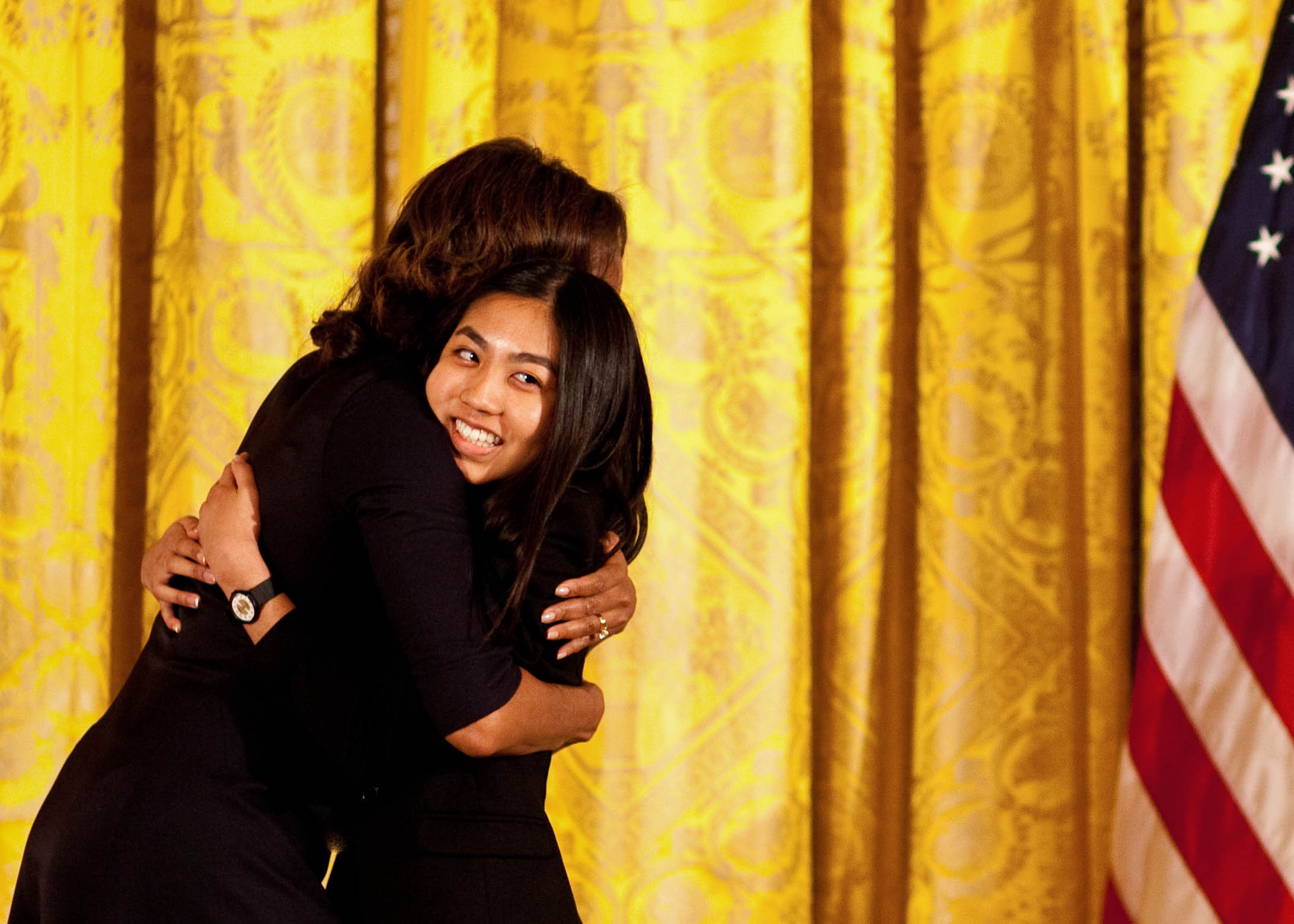 WriteGirl mentee Jackie, 16, sharing a hug with the first lady