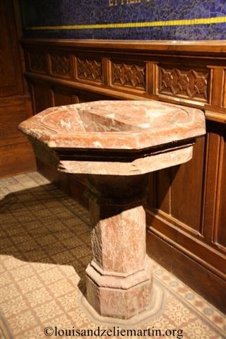 the baptismal font in st. eulalie's church, bordeaux, dating from the time of st. louis martin's baptism.