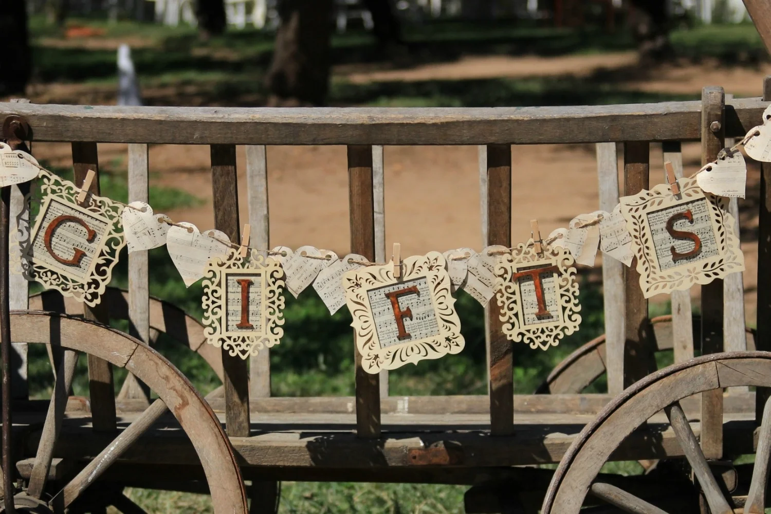 "GIFTS" BANNER - $10 Wood frames with vintage sheet music and hearts on twine