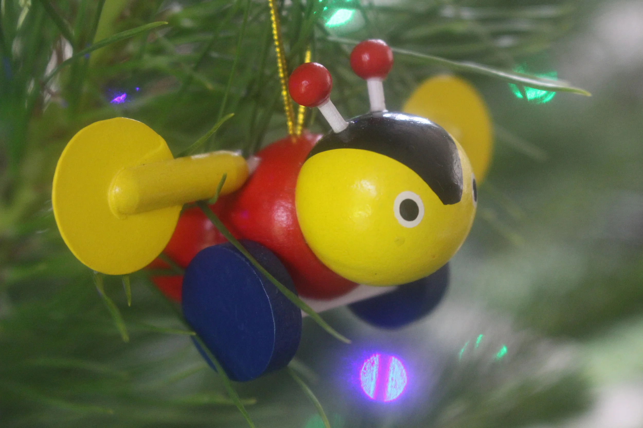 Classic Kiwi Buzzy Bee christmas ornament, photo by Sunstone