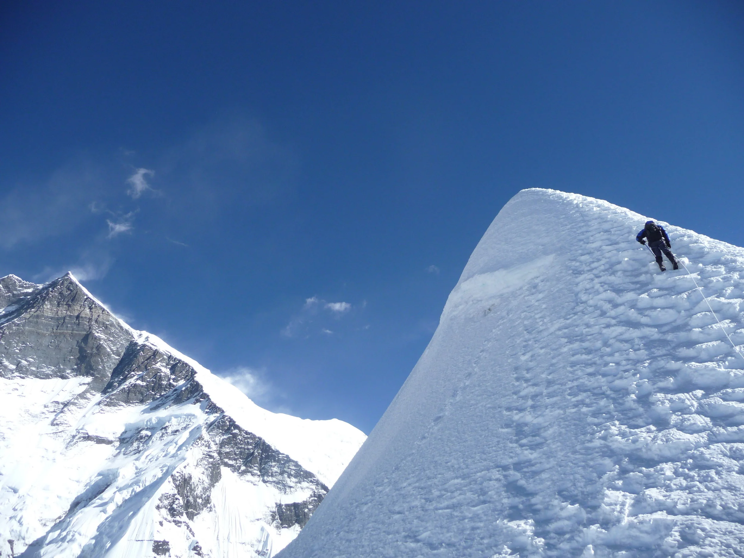 Our lead climber about to Summit Island Peak (6189m), Everest Region, photo by Paul Swettenham
