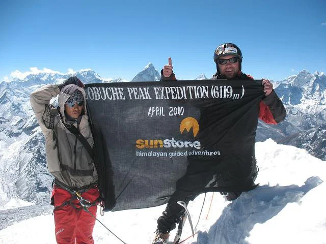 Paul summiting Lobuche Peak 6189m in the Himalayas, Nepal photo Sunstone Collection