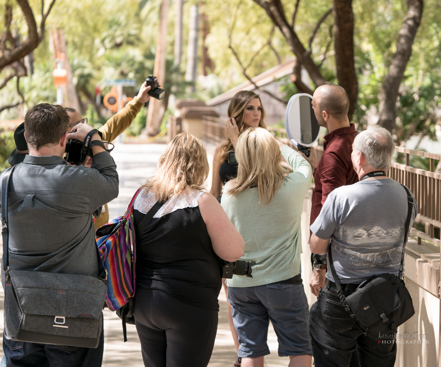 Mike Colon holds a speedlight that has been modified, while another participant captures the image. 