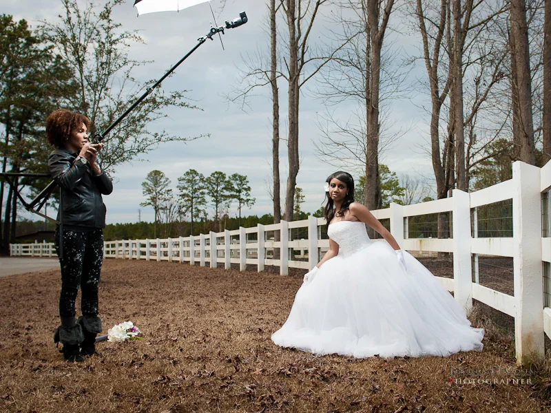 Behind the Scenes, Shameka holds the light above Ebony's head
