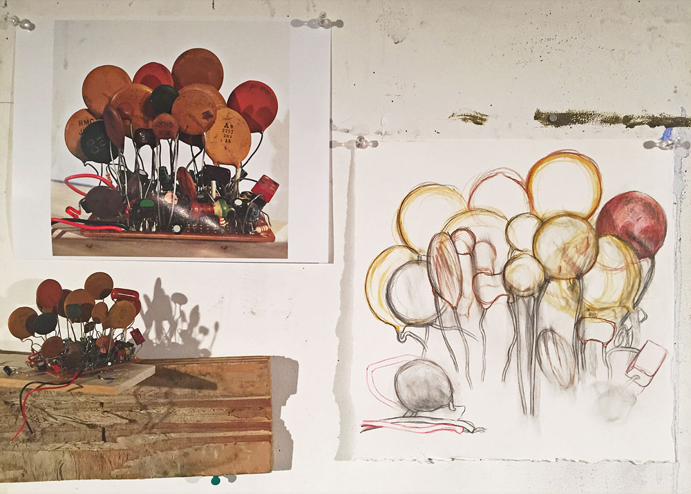 Scene from my studio today. Above are my model, and a photograph and drawing of the same.