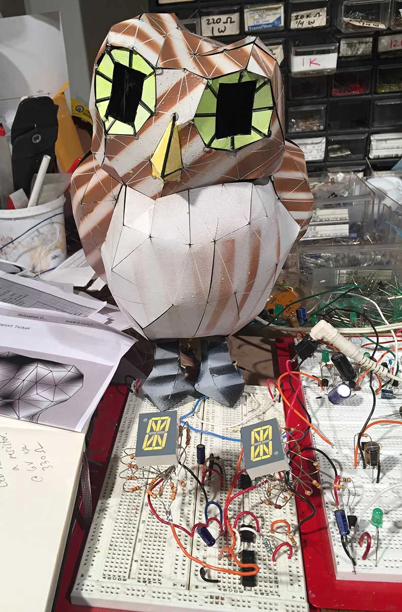 Paper owl looking onto its electronic eye circuit, 2018