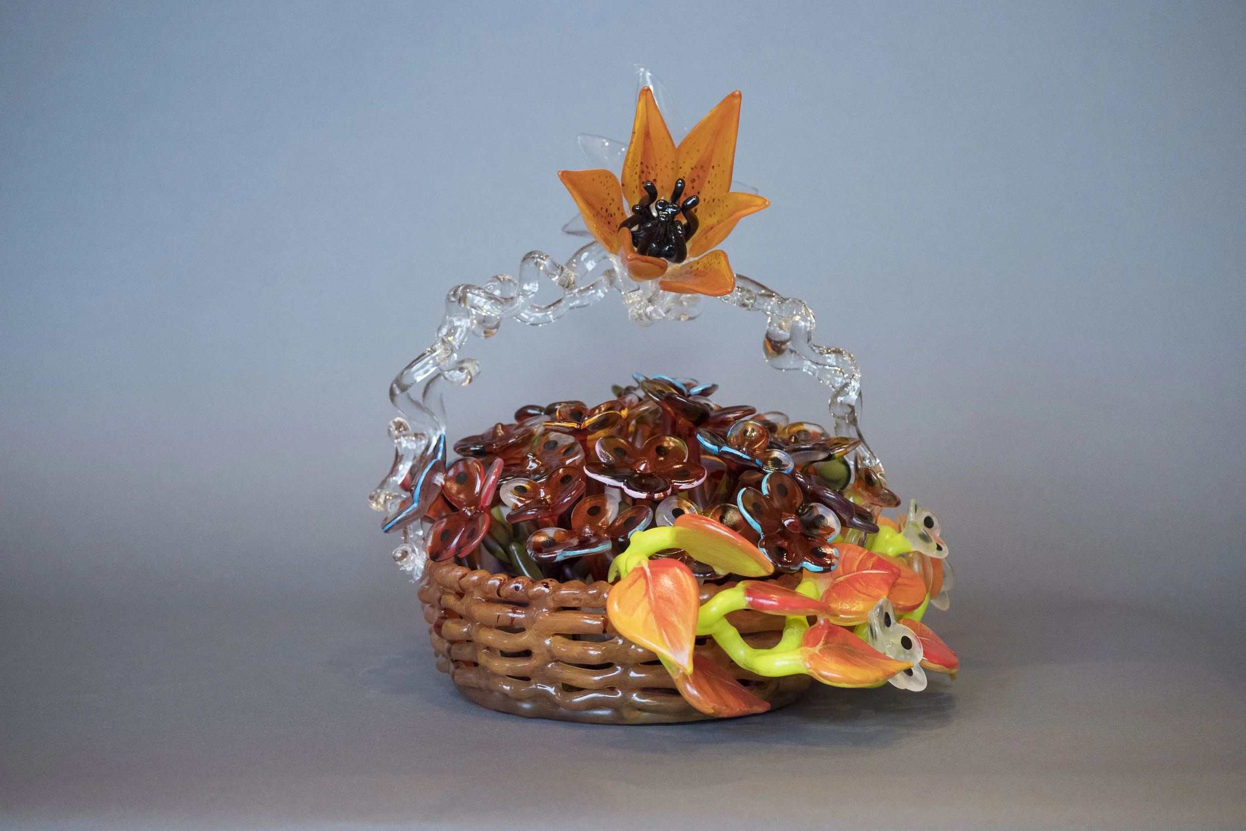 2017 Lily Handled Basket of Flowers 15h_x_18w_x_14d by Ginny Ruffner
