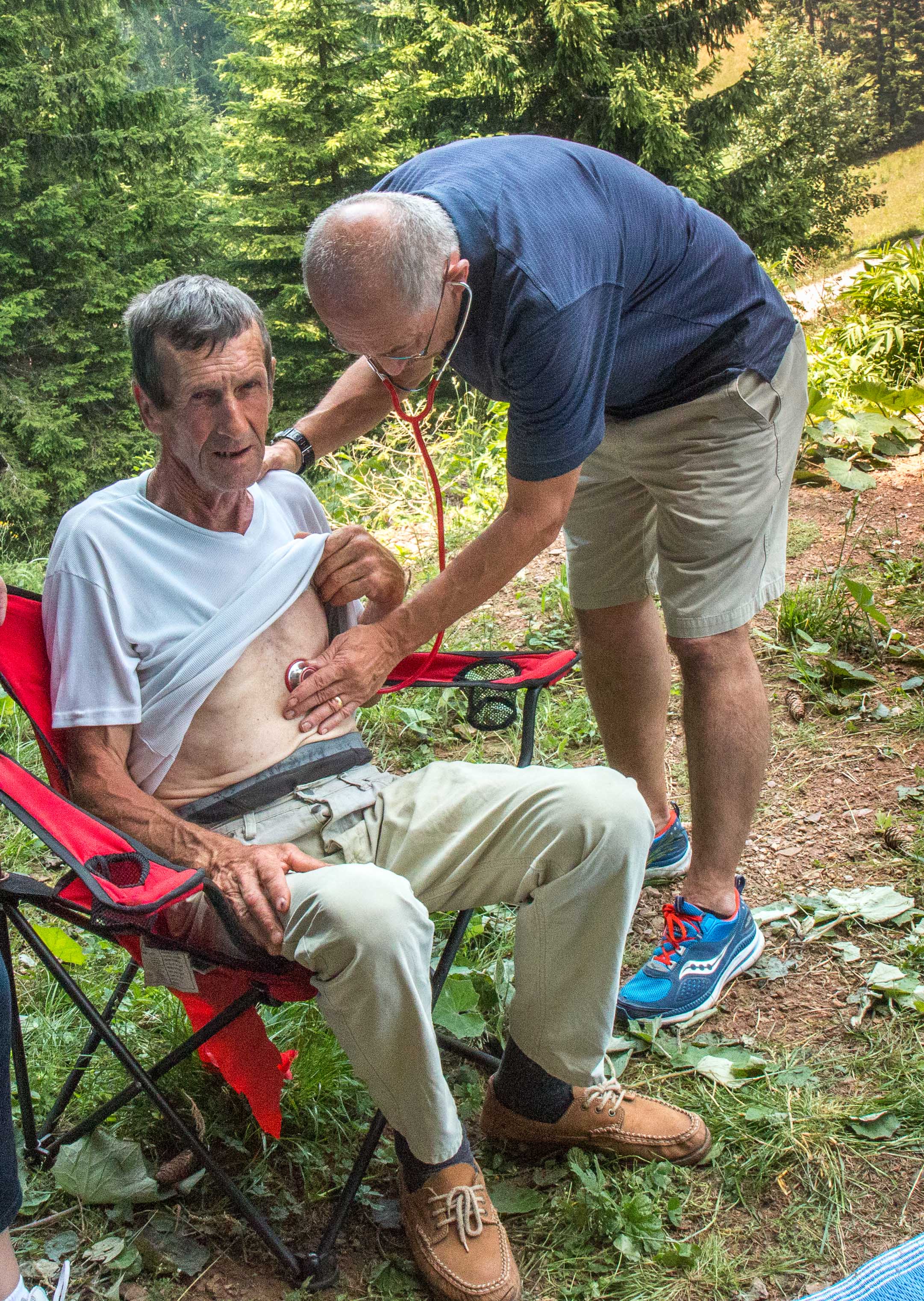 "Doctor" Wayne examining a patient